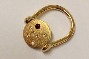 Bespoke garnet and diamond greek spin ring handmade in 18ct yellow gold by charmian beaton design