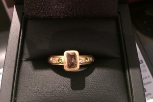 Handmade engagement ring set with rough, uncut chocolate diamonod, green tourmaline and diamonds set in 18ct yellow gold by charmian beaton design